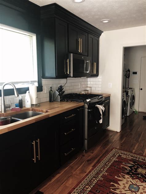 dark kitchen cabinets stainless steel appliances and butcher block|kitchens with butcher blocks.